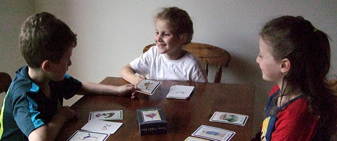 Children playing with the cards